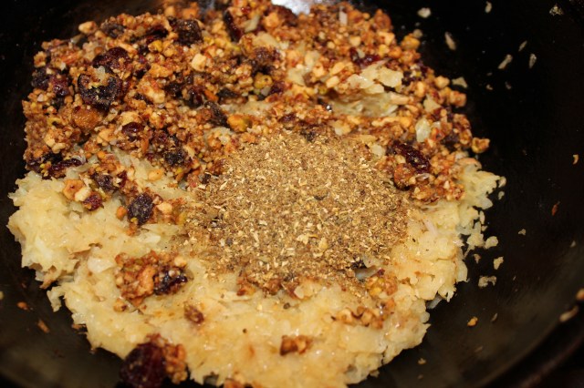 Ground spices and nut blend added to onion mixture