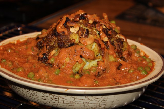 Assemble the stuffed cauliflower with sauce