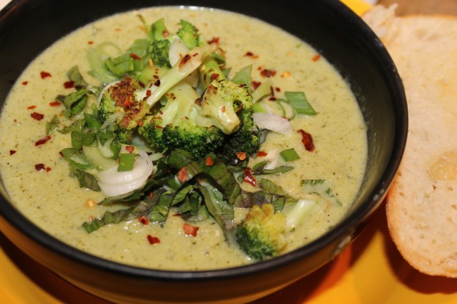 Cream of Broccoli soup served with a slice of warm garlic bread
