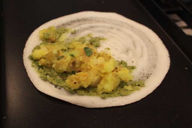 Spread with chutney and potato stuffing, then fold over. Spread with chutney and potato stuffing, then fold over.