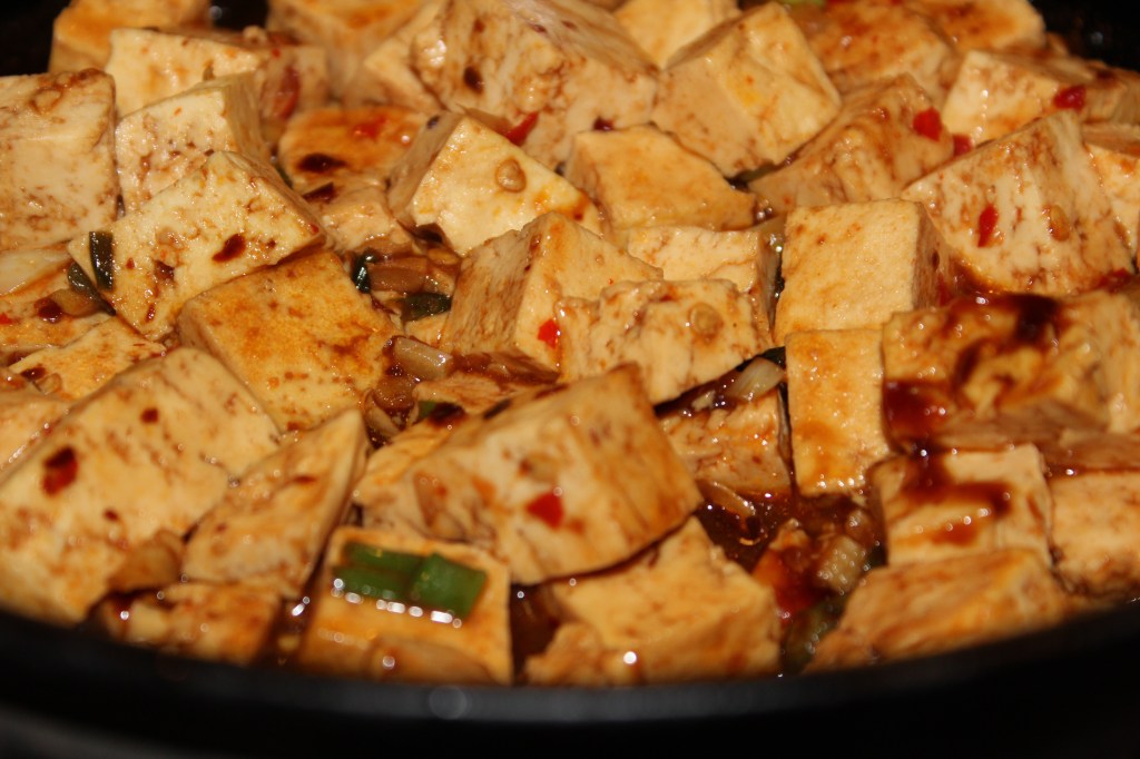 Stir the sauces and tofu gently together