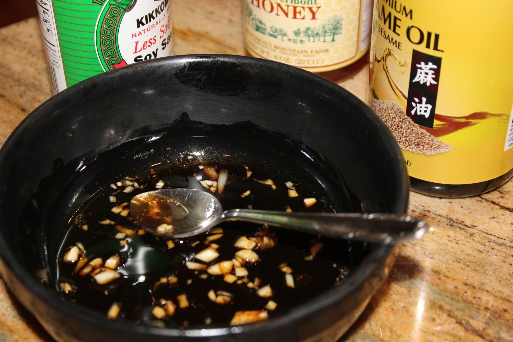 Mix together soy sauce, honey, vinegar, sesame oil and minced garlic