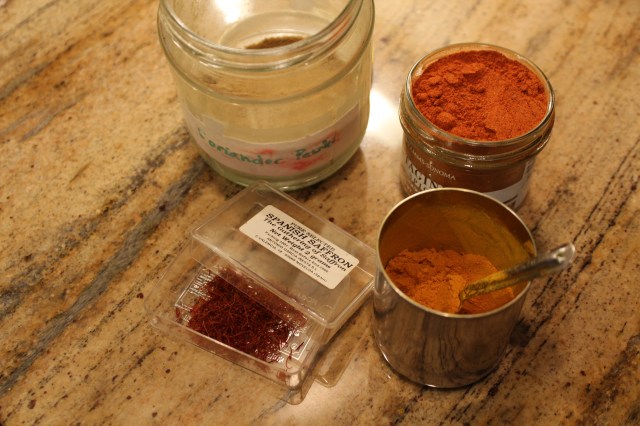 Spices, clockwise from top: coriander powder, tagine spice mix, turmeric and saffron