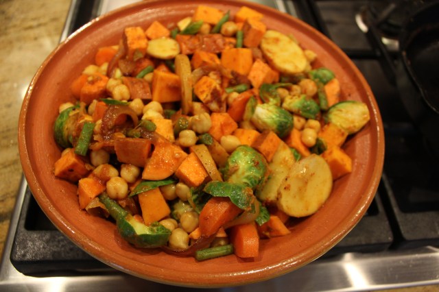 Toss the sauce with the cubed vegetables and mound into the tagine base
