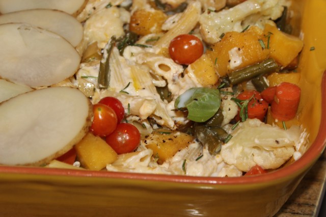 A medley of vegetables tossed with penne in a creamy sauce.